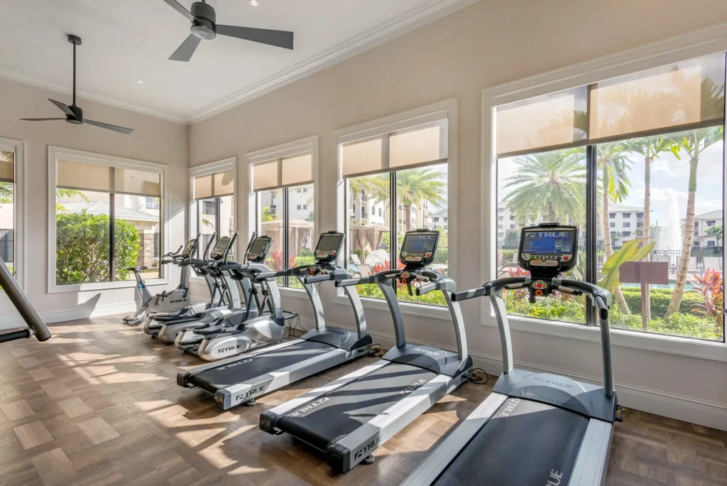 Fitness center with cardio equipment.