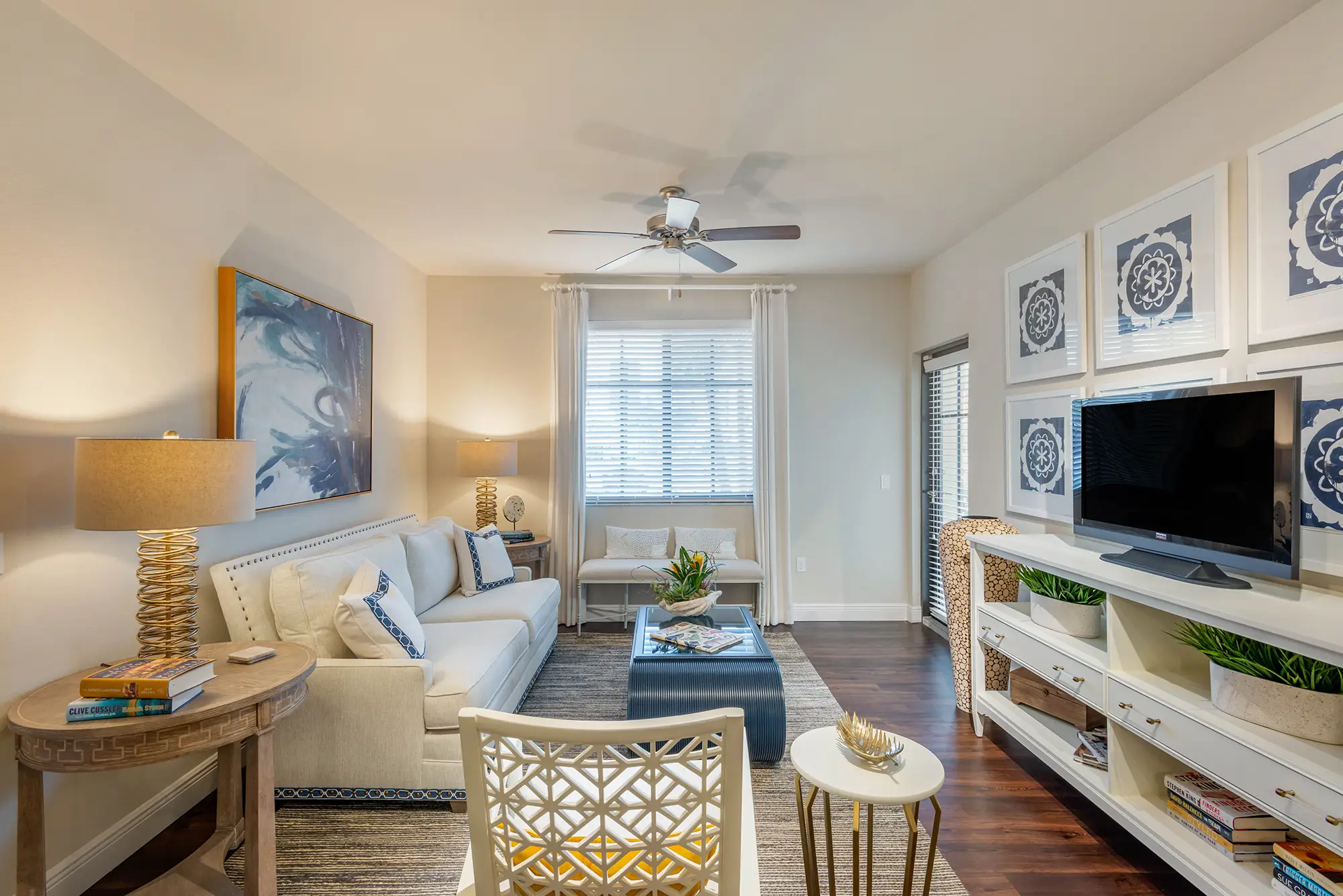 Living room with access to patio and ceiling fans