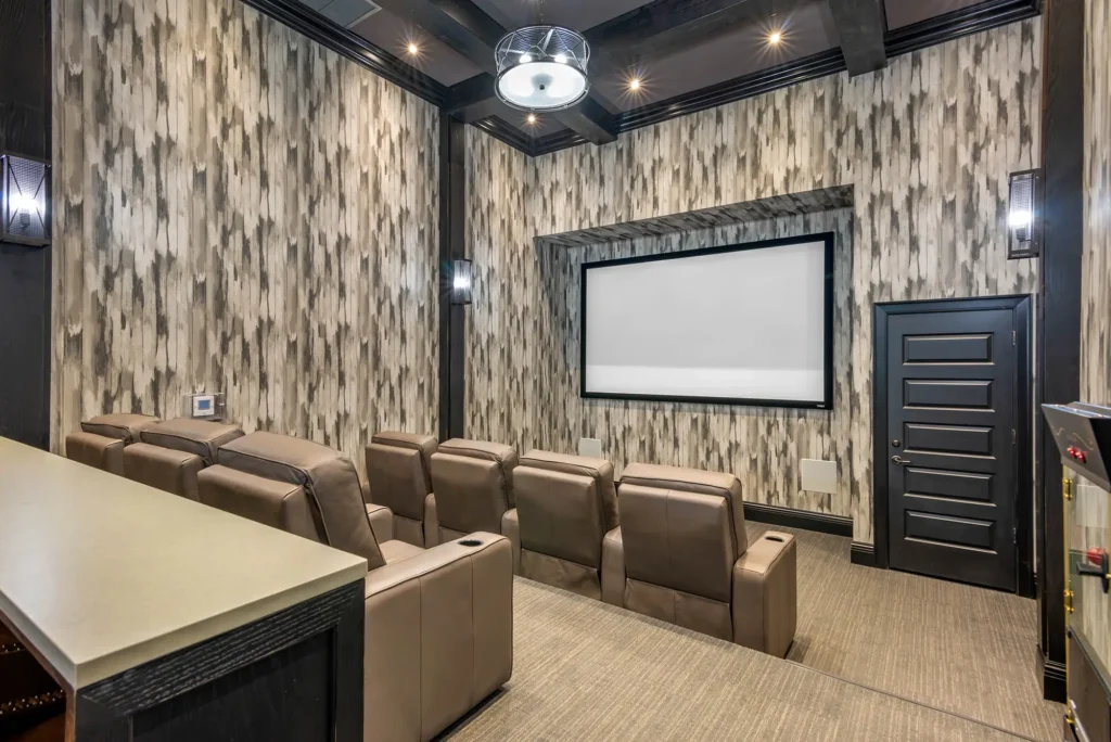 Movie theater room with seven leather seats.