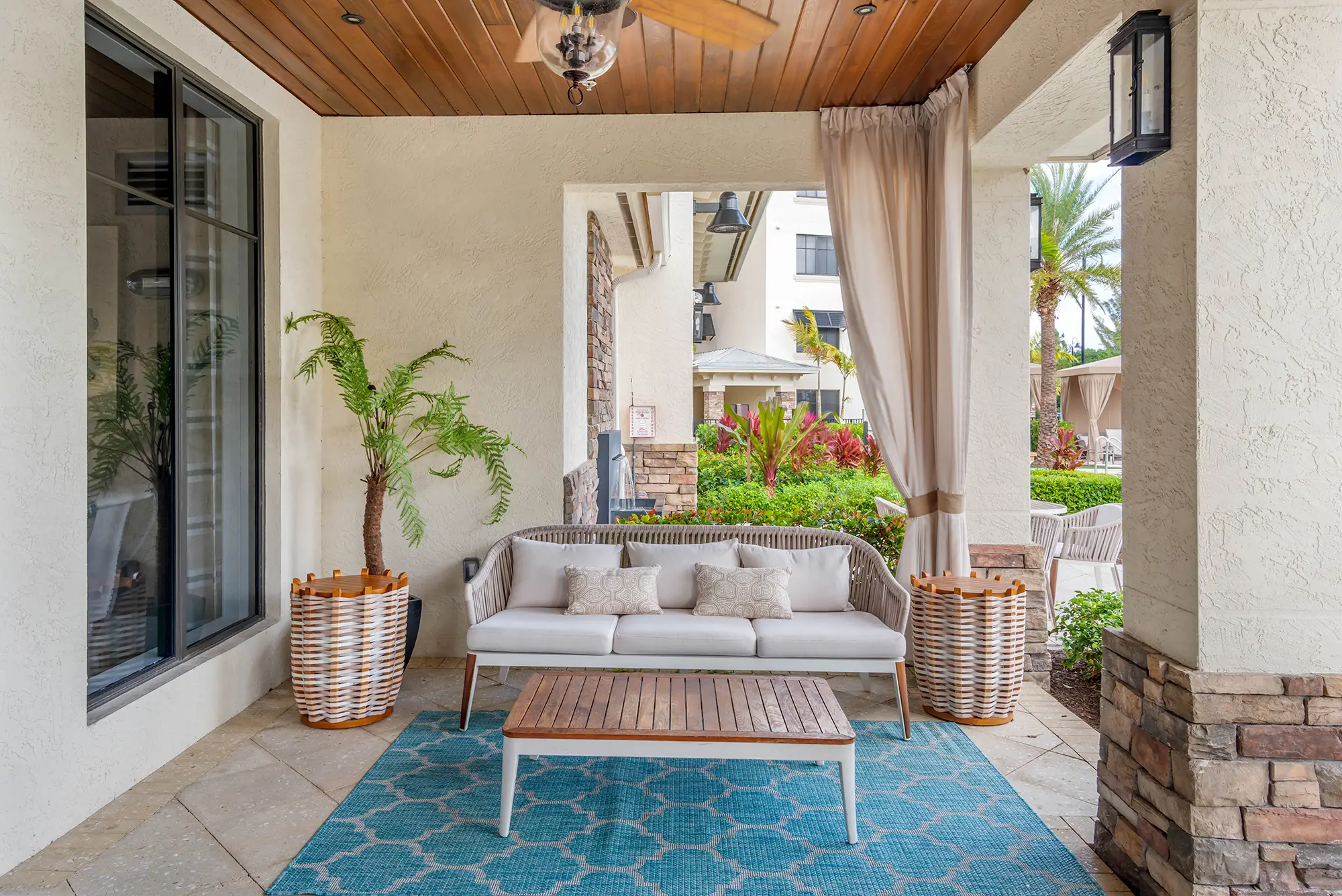 Outdoor covered seating space with fan